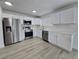 Modern kitchen with stainless steel appliances, and subway tile backsplash at 17 Oak Loop, Ocala, FL 34472