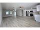 Open-concept living area connecting to the kitchen with stainless steel appliances at 17 Oak Loop, Ocala, FL 34472