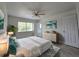 Bright and well-lit main bedroom with large window and neutral decor at 17 Oak Loop, Ocala, FL 34472