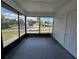 Covered and screened-in porch provides relaxing outdoor living at 17 Oak Loop, Ocala, FL 34472