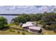 Expansive property featuring a home with a sprawling yard and waterfront access on a tranquil lake at 2292 Se 170Th Avenue Rd, Silver Springs, FL 34488