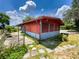 Exterior of a charming home, showcasing its unique architectural details and well-maintained surroundings at 2292 Se 170Th Avenue Rd, Silver Springs, FL 34488