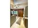 Eat-in kitchen with wooden paneling plus stacked washer and dryer at 2292 Se 170Th Avenue Rd, Silver Springs, FL 34488