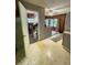 A laundry room offers a practical workspace with washer/dryer, natural light, and ample storage solutions at 2292 Se 170Th Avenue Rd, Silver Springs, FL 34488