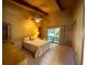 Vaulted main bedroom with ensuite, ceiling fan, and backyard view at 2292 Se 170Th Avenue Rd, Silver Springs, FL 34488