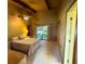 Main bedroom with ensuite, ceiling fan, and view of backyard at 2292 Se 170Th Avenue Rd, Silver Springs, FL 34488