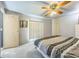 Charming bedroom with a ceiling fan, soft carpet, a window with blinds, and ample closet space at 97 Parson Dr, Winter Haven, FL 33884