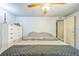 Bright bedroom with a ceiling fan, dresser, and neutral walls, creating a relaxing atmosphere at 97 Parson Dr, Winter Haven, FL 33884