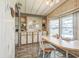 Bright dining room featuring built-in cabinetry, a large window, and laminate flooring at 97 Parson Dr, Winter Haven, FL 33884