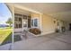 Home exterior with screened porch, carport, garden bed, bench, and welcoming entrance at 97 Parson Dr, Winter Haven, FL 33884