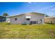 Well-maintained exterior with a manicured lawn, central AC, a window awning and vinyl siding at 97 Parson Dr, Winter Haven, FL 33884
