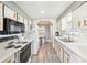 Efficient kitchen features white cabinetry, laminate countertops, and modern appliances at 97 Parson Dr, Winter Haven, FL 33884