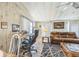 Cozy living room featuring a comfortable leather couch, workspace, and natural lighting at 97 Parson Dr, Winter Haven, FL 33884