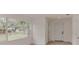 Bright entryway with a large window, white door, and hardwood floors at 1255 Pine St, Altamonte Springs, FL 32701