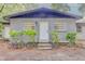 Charming single-story home featuring a gray brick exterior, well-maintained landscaping, and a welcoming front entrance at 1255 Pine St, Altamonte Springs, FL 32701