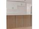 Stylish kitchen features a wood-look kitchen island with modern white cabinets at 1255 Pine St, Altamonte Springs, FL 32701