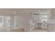 Modern kitchen features white cabinets, an island, and ample counter space, creating a clean and functional cooking area at 1255 Pine St, Altamonte Springs, FL 32701
