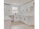 Bright kitchen showcases sleek white cabinets, modern hardware, and a functional layout perfect for cooking at 1255 Pine St, Altamonte Springs, FL 32701