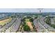 Overhead view showcases the proximity to the Walt Disney World Resort Area and the community's layout near green spaces at 1890 Flora Pass Pl, Kissimmee, FL 34747