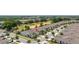 Scenic aerial capture of a community near a golf course, emphasizing the verdant surroundings and access to recreational space at 1890 Flora Pass Pl, Kissimmee, FL 34747