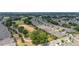 Scenic aerial view of a community with well-placed homes near a golf course, offering a serene living environment at 1890 Flora Pass Pl, Kissimmee, FL 34747