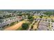 Expansive aerial view of a residential community with lush greenery, golf course, and well-maintained homes at 1890 Flora Pass Pl, Kissimmee, FL 34747