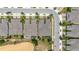 A beautiful aerial view of a residential community with well-maintained lawns, landscaping and a community pool at 1890 Flora Pass Pl, Kissimmee, FL 34747