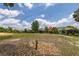 Scenic view of the backyard overlooking the golf course, marked with a Par 3 16 sign at 1890 Flora Pass Pl, Kissimmee, FL 34747