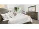 Bright bedroom with a large window, wood furnishings, and neutral decor at 1890 Flora Pass Pl, Kissimmee, FL 34747