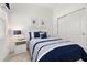 Comfortable bedroom featuring modern decor with white trim and plenty of natural light at 1890 Flora Pass Pl, Kissimmee, FL 34747