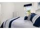 Comfortable bedroom featuring modern decor with white trim and plenty of natural light at 1890 Flora Pass Pl, Kissimmee, FL 34747