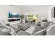 The bright living room features a comfortable couch and patio access at 1890 Flora Pass Pl, Kissimmee, FL 34747
