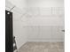 Spacious walk-in closet with wire shelving and ceramic tile flooring at 1890 Flora Pass Pl, Kissimmee, FL 34747