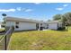 Spacious backyard features a patio with outdoor furniture and a grill at 8225 Sw 108Th Street Rd, Ocala, FL 34481