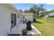 Back patio featuring outdoor furniture, a grill, and a view of the yard at 8225 Sw 108Th Street Rd, Ocala, FL 34481