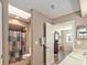 Bright bathroom area featuring a shower and sink and a door open to another room at 8225 Sw 108Th Street Rd, Ocala, FL 34481