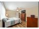 Cozy bedroom featuring hardwood floors, neutral tones, and generous natural light at 8225 Sw 108Th Street Rd, Ocala, FL 34481