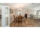 Dining area featuring wood table, hardwood floors and a view of the living room at 8225 Sw 108Th Street Rd, Ocala, FL 34481