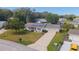 Charming single-story home featuring a well-maintained lawn, long driveway, and solar panels for energy efficiency at 8225 Sw 108Th Street Rd, Ocala, FL 34481