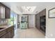 View of the kitchen featuring stainless steel appliances, tiled flooring, and a window to the yard at 8225 Sw 108Th Street Rd, Ocala, FL 34481