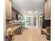 Long kitchen with dark wooden cabinets, and ample counter space at 8225 Sw 108Th Street Rd, Ocala, FL 34481