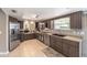 Well-lit kitchen with stainless steel appliances, dual basin sink, and updated wood cabinetry at 8225 Sw 108Th Street Rd, Ocala, FL 34481