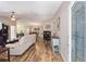 Open-concept living area with hardwood floors, vaulted ceilings, and plenty of natural light at 8225 Sw 108Th Street Rd, Ocala, FL 34481