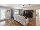 Inviting living room features hardwood floors, comfortable seating, and natural light from the window at 8225 Sw 108Th Street Rd, Ocala, FL 34481