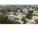 A beautiful neighborhood surrounded by lush trees with well-maintained houses and yards at 8225 Sw 108Th Street Rd, Ocala, FL 34481