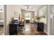 Bright home office featuring hardwood floors, natural light, and comfortable workspace at 8225 Sw 108Th Street Rd, Ocala, FL 34481