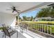 Comfortable front porch with a ceiling fan, ample seating, and a lovely view of the neighborhood at 8225 Sw 108Th Street Rd, Ocala, FL 34481