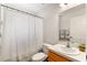 Bright bathroom featuring a single sink vanity, toilet, and shower-tub combo at 9700 Sw 196 Circle, Dunnellon, FL 34432