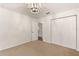 Neutral bedroom with carpet flooring and double door closet for plenty of storage space at 9700 Sw 196 Circle, Dunnellon, FL 34432