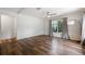 Spacious bedroom with wood-look flooring, neutral walls, and ample natural light at 9700 Sw 196 Circle, Dunnellon, FL 34432